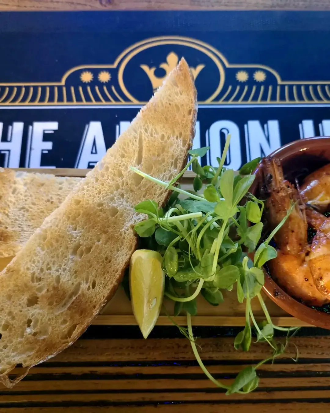 Garlic prawns with sourdough on an Albion Inn board