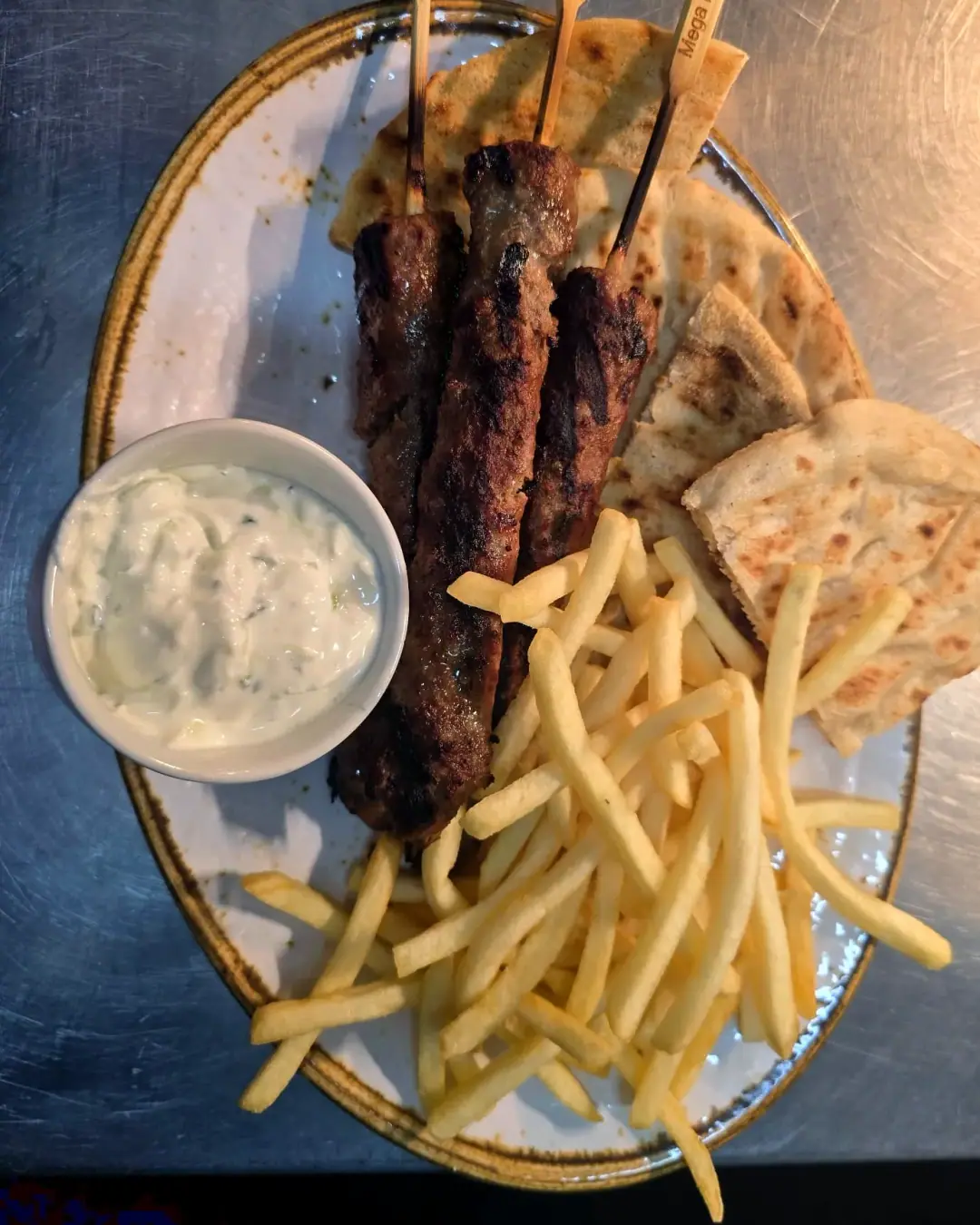 Kofta skewers with pitta, fries and tzatziki
